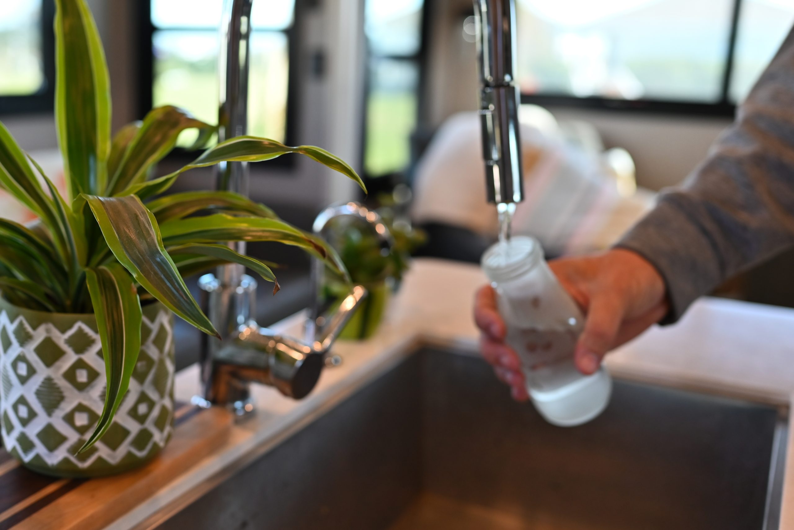 Filling a bottle with water